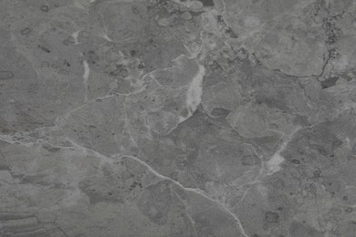 Photo of Texture of grey marble surface as background, closeup