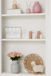 Shelves with different decor indoors. Interior design