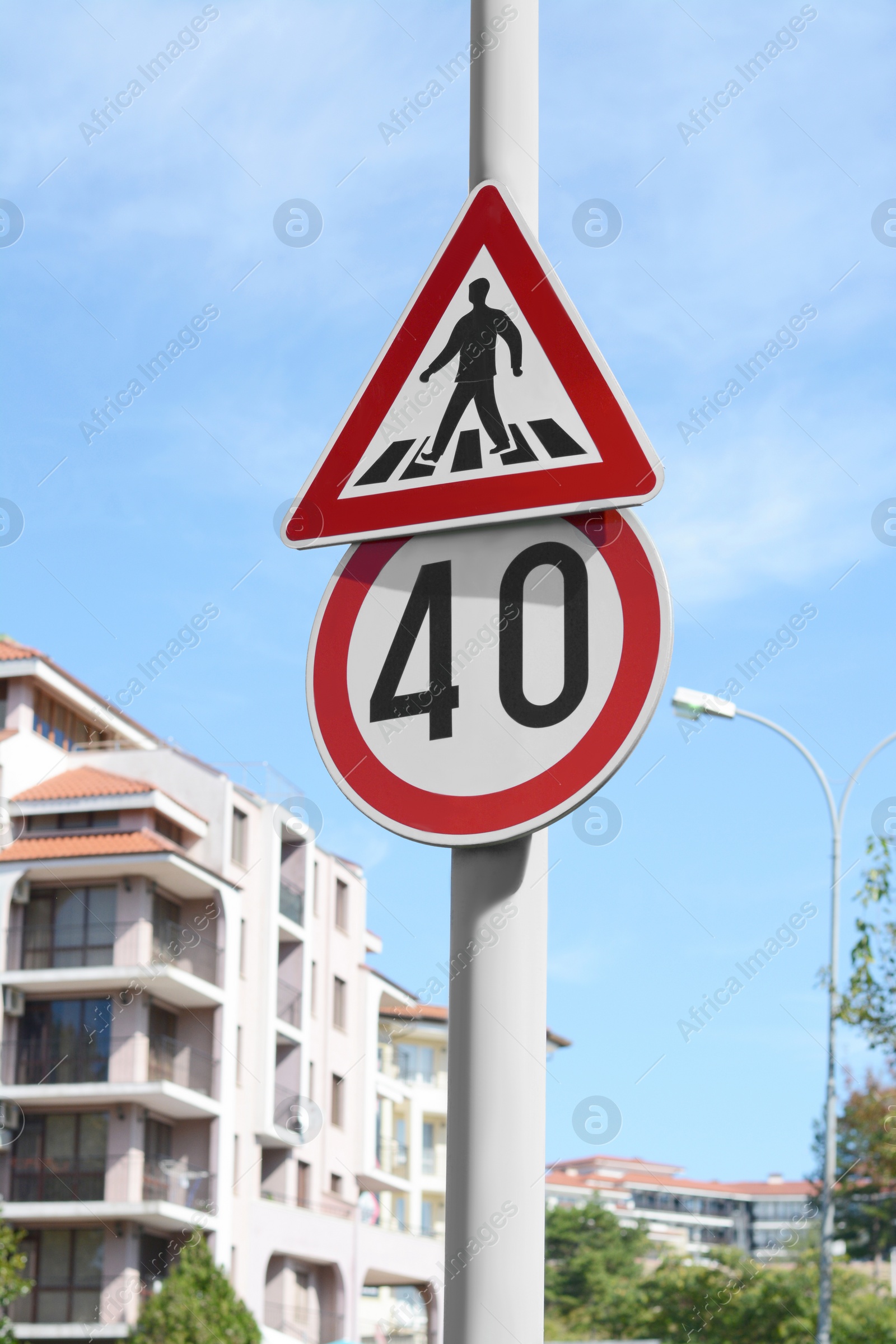 Photo of Post with different road signs outdoors on sunny day