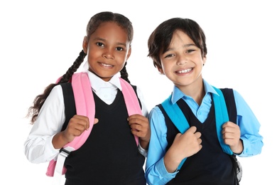 Photo of Happy children in school uniform on white background