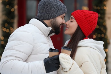 Lovely couple spending time together on city street