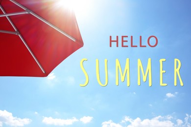 Image of Hello Summer. Red umbrella and blue sky on sunny day