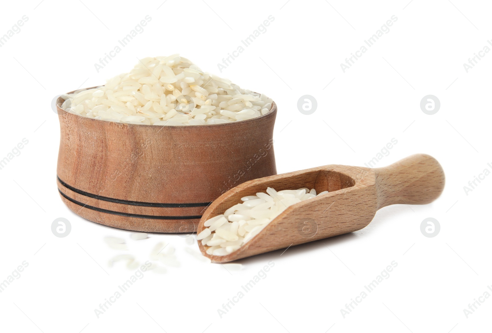 Photo of Bowl and scoop with uncooked rice on white background