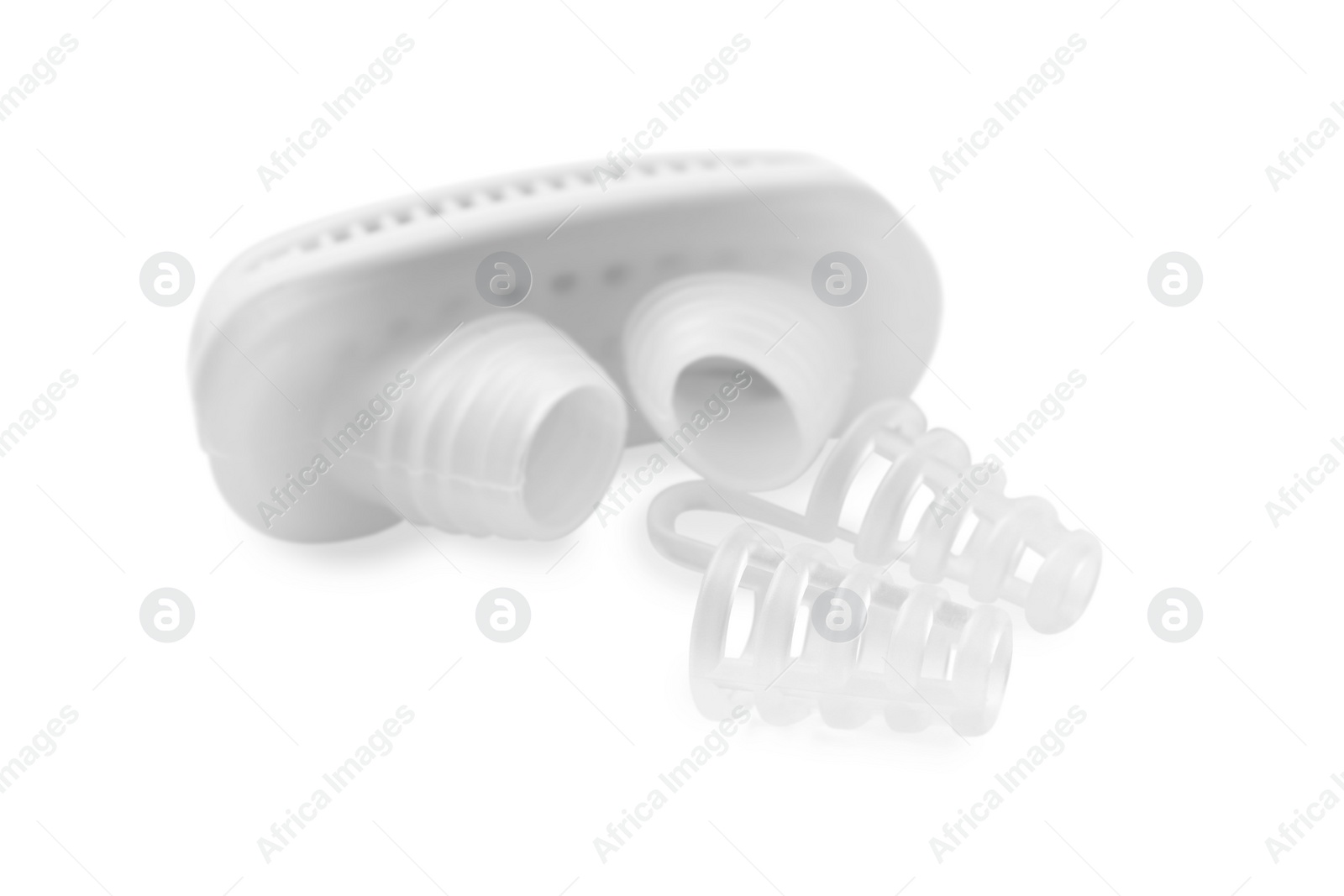 Photo of Different anti-snoring devices for nose on white background