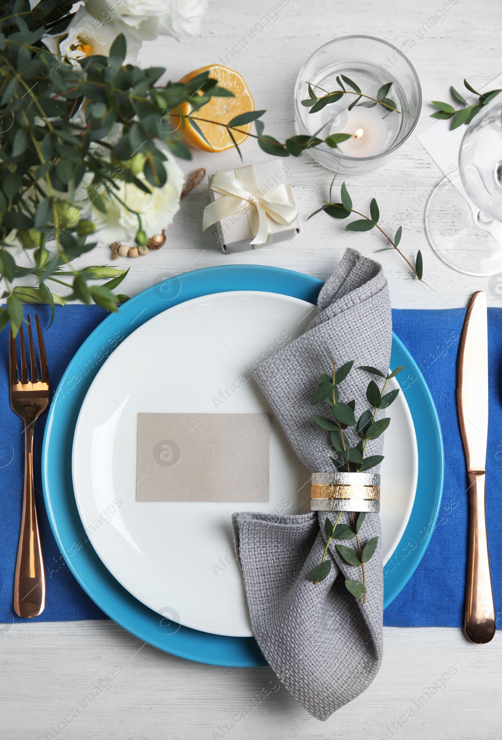 Photo of Elegant festive table setting on white wooden background, flat lay