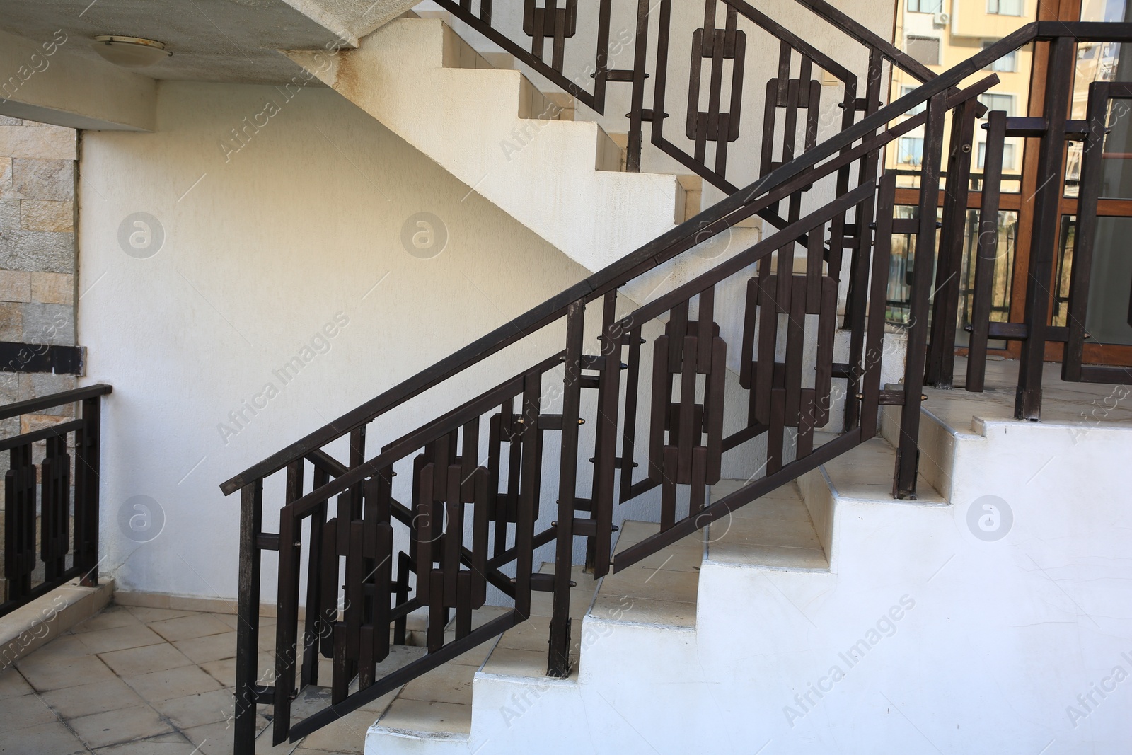 Photo of View of beautiful stairs with metal handrails near house outdoors