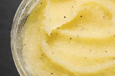 Photo of Body scrub in jar, closeup. Skin care product