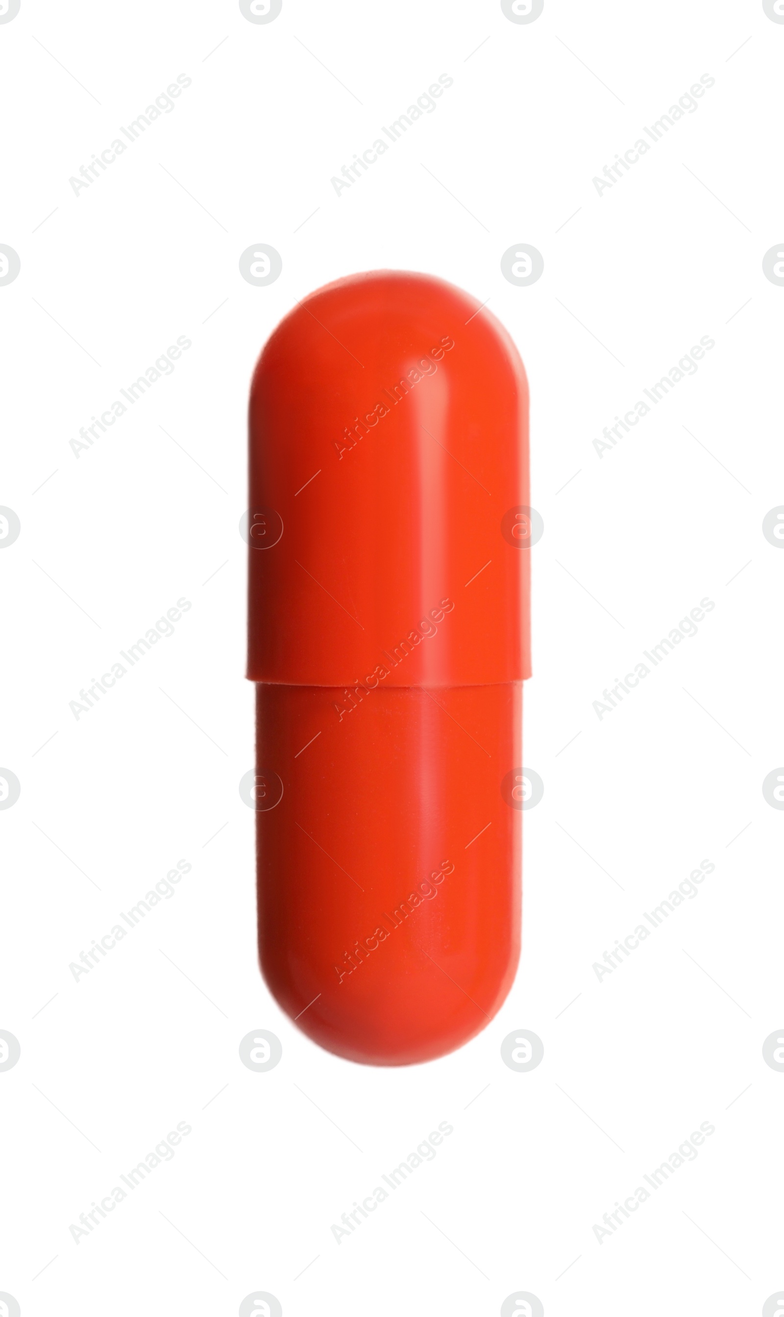 Photo of One orange pill on white background. Medicinal treatment