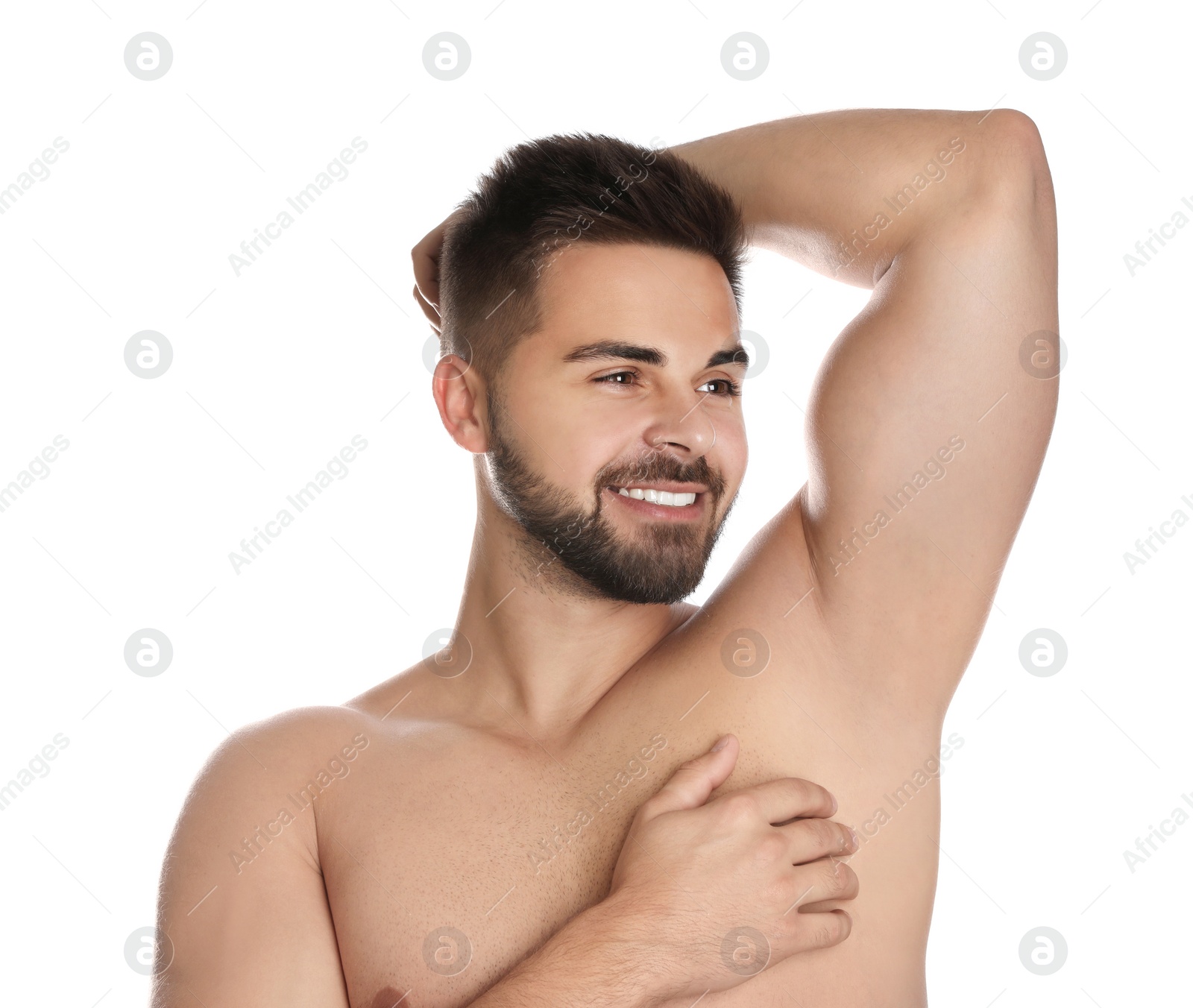 Image of Young man showing hairless armpit after epilation procedure on white background