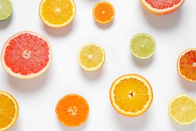 Photo of Flat lay composition with different citrus fruits on white background