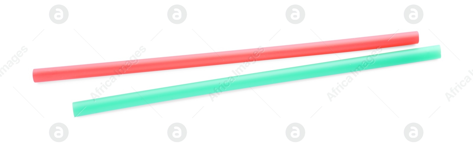 Photo of Color plastic cocktail tubes on white background