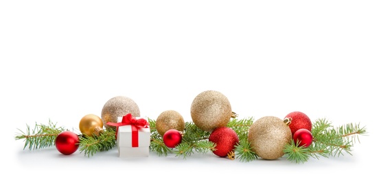 Photo of Composition with Christmas tree branches, festive decor and gift box on white background