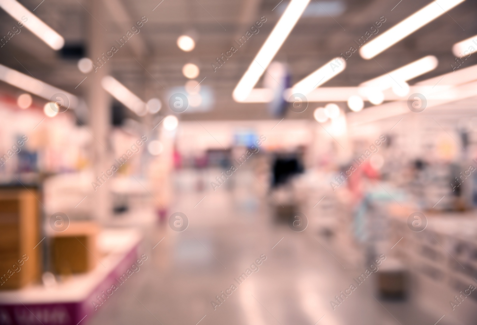 Photo of Blurred view of modern shopping mall interior