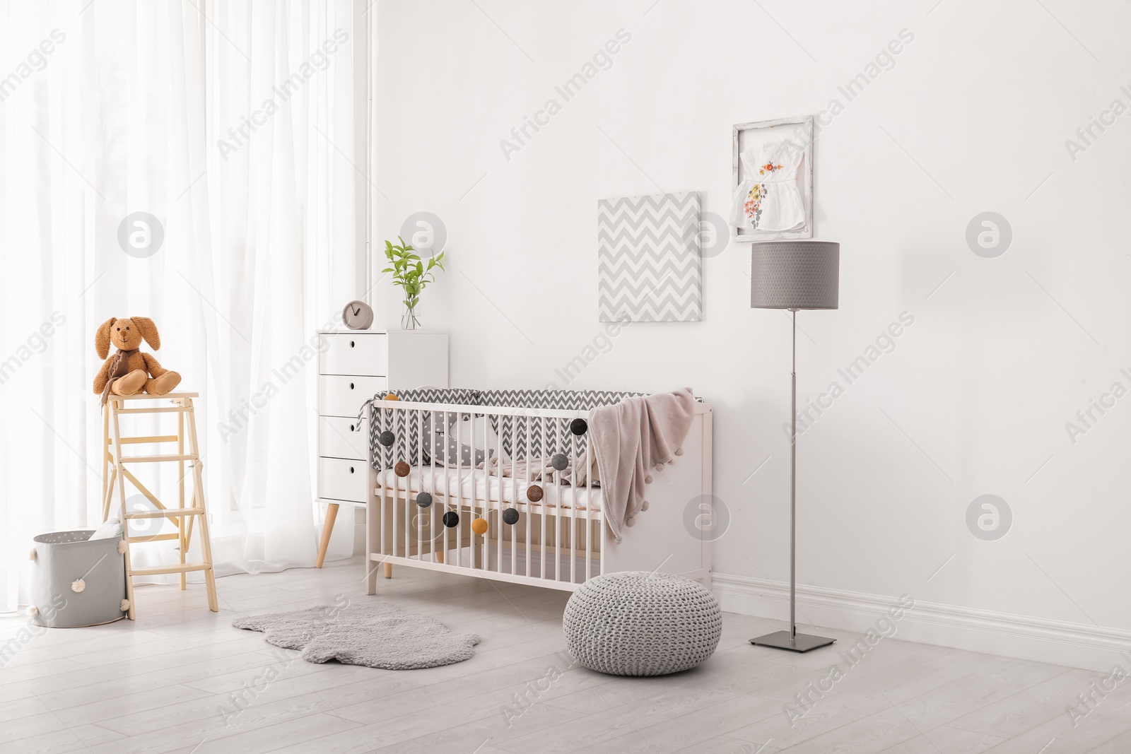 Photo of Baby room interior with comfortable crib