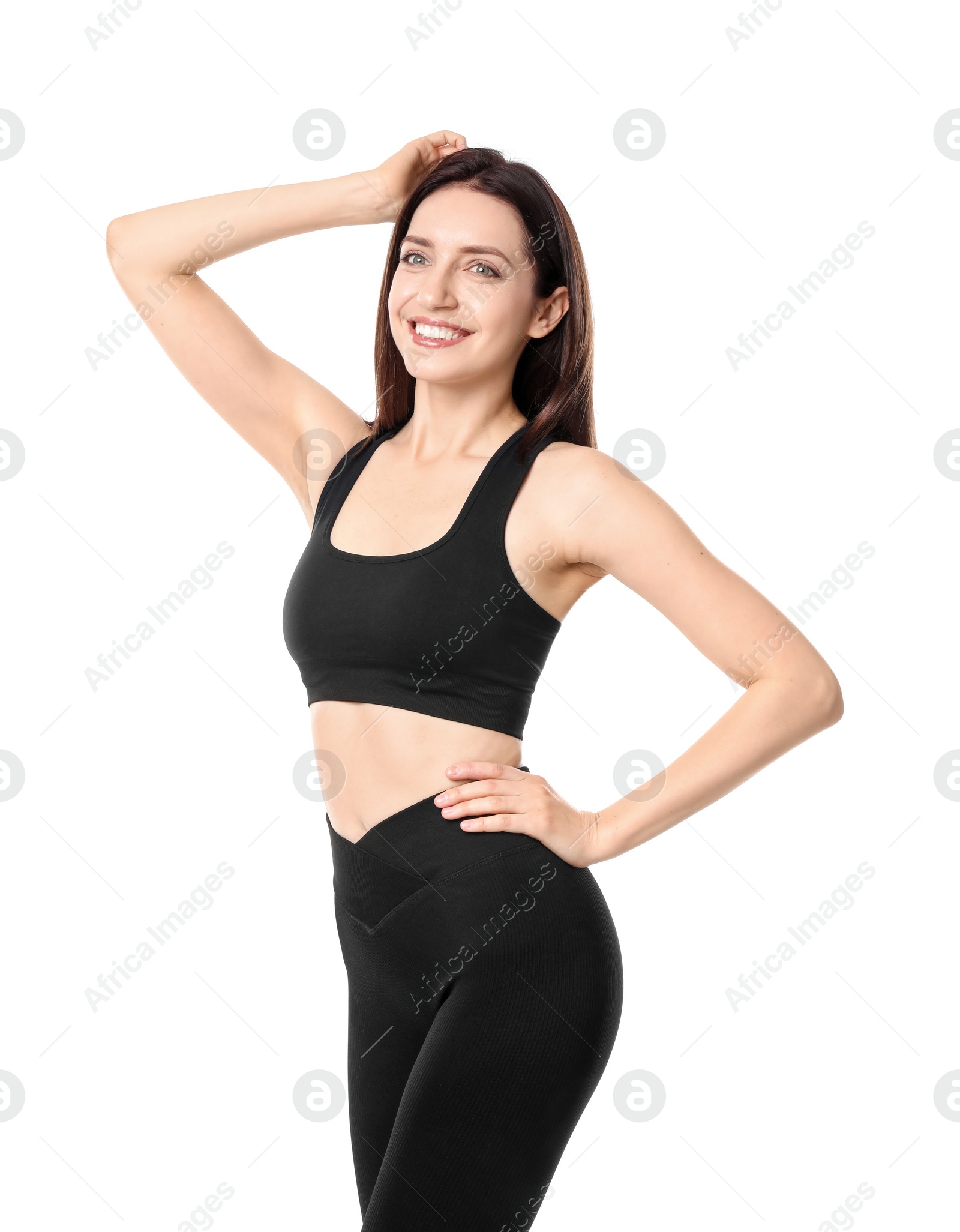 Photo of Happy young woman with slim body posing on white background