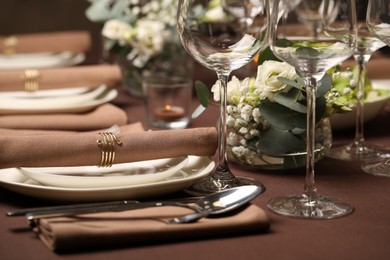 Photo of Stylish elegant table setting for festive dinner in restaurant