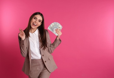 Businesswoman with money on color background. Space for text