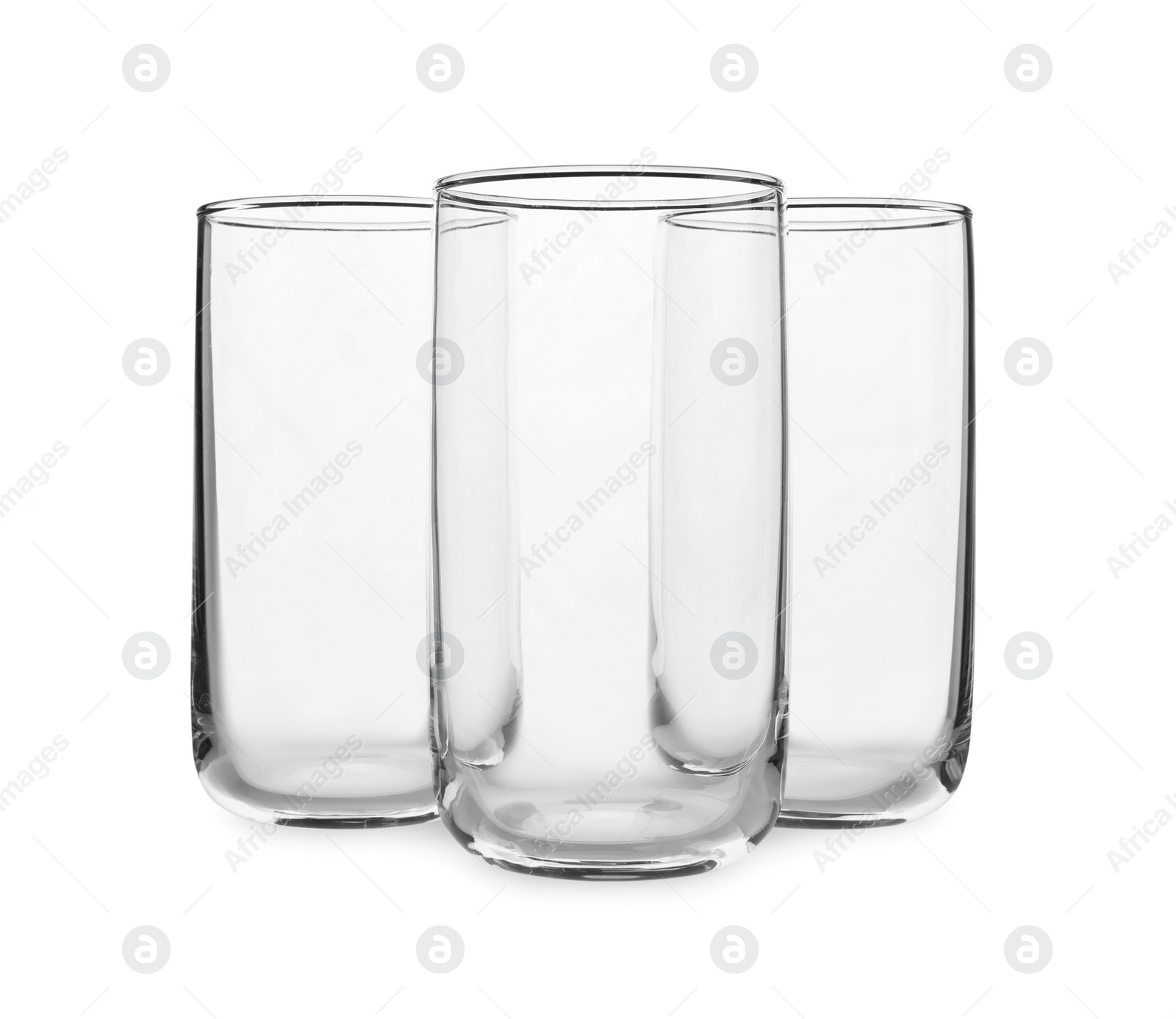 Photo of New clean empty glasses on white background