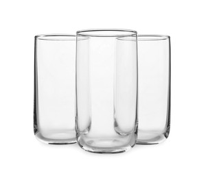 Photo of New clean empty glasses on white background