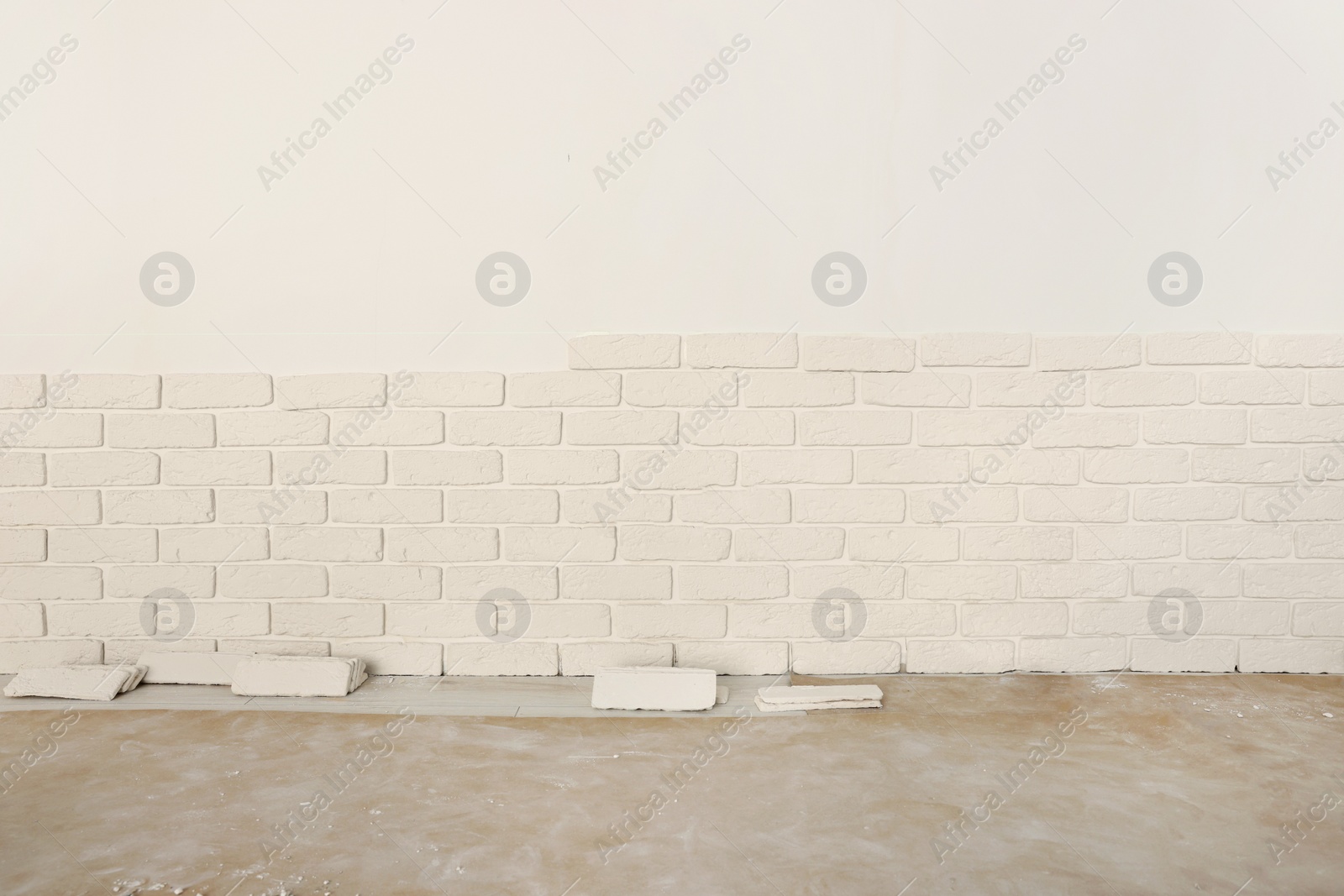 Photo of Wall with decorative tiles in room. Interior design