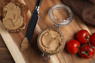 Photo of Delicious meat pate, fresh bread and cherry tomatoes on wooden table, flat lay