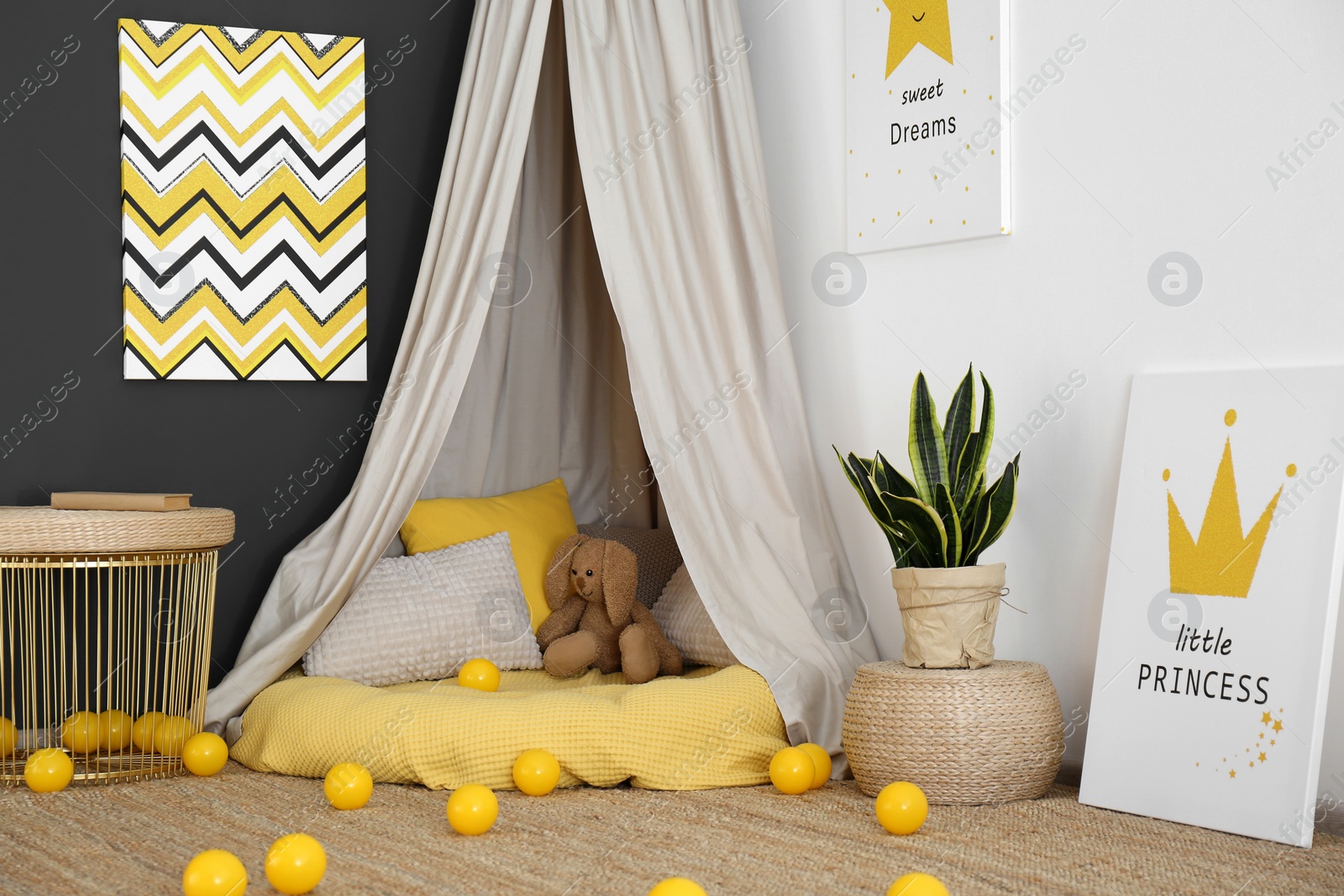 Photo of Baby room interior with play tent and cute posters