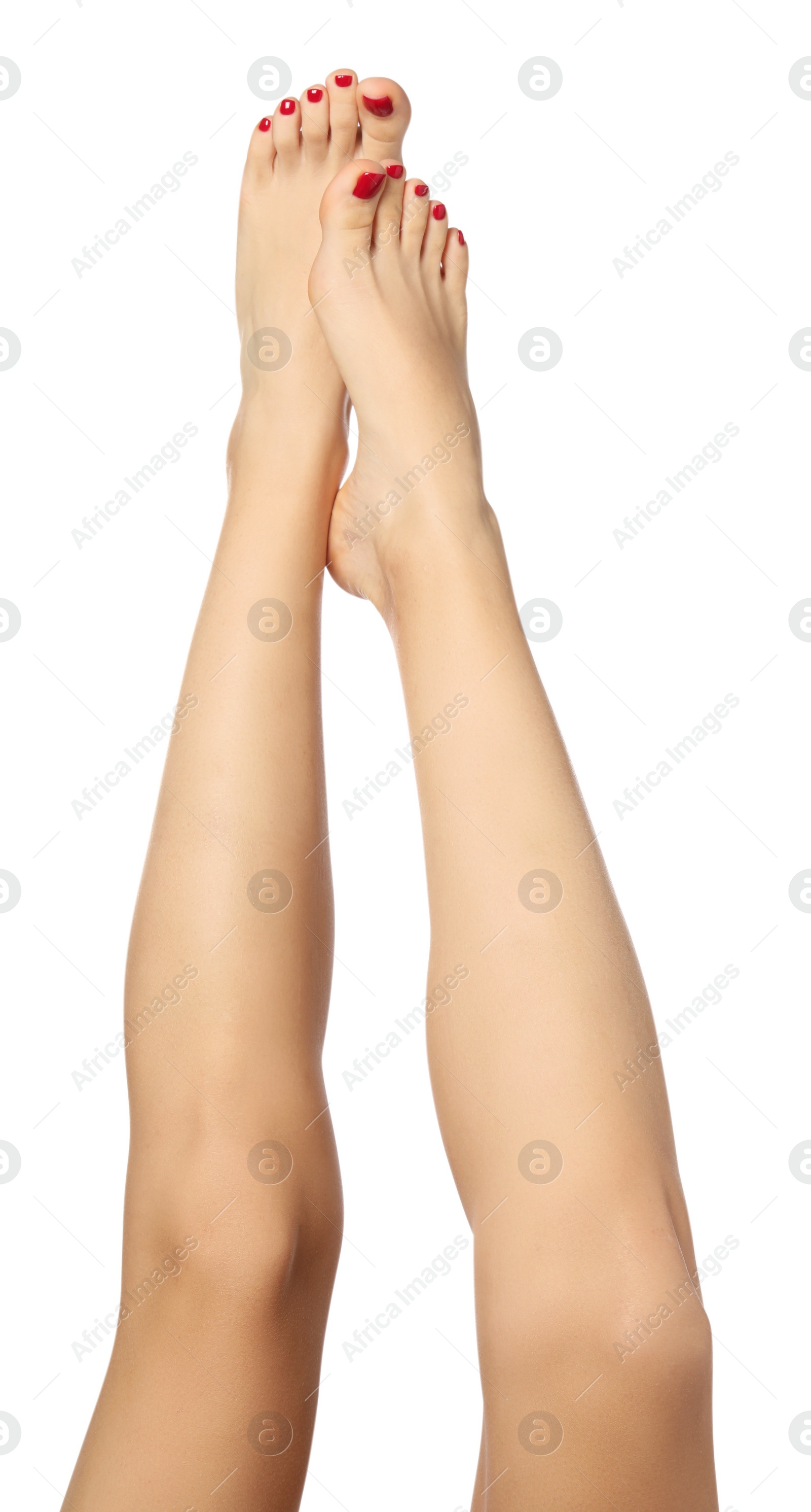 Photo of Woman with stylish red toenails after pedicure procedure isolated on white, closeup