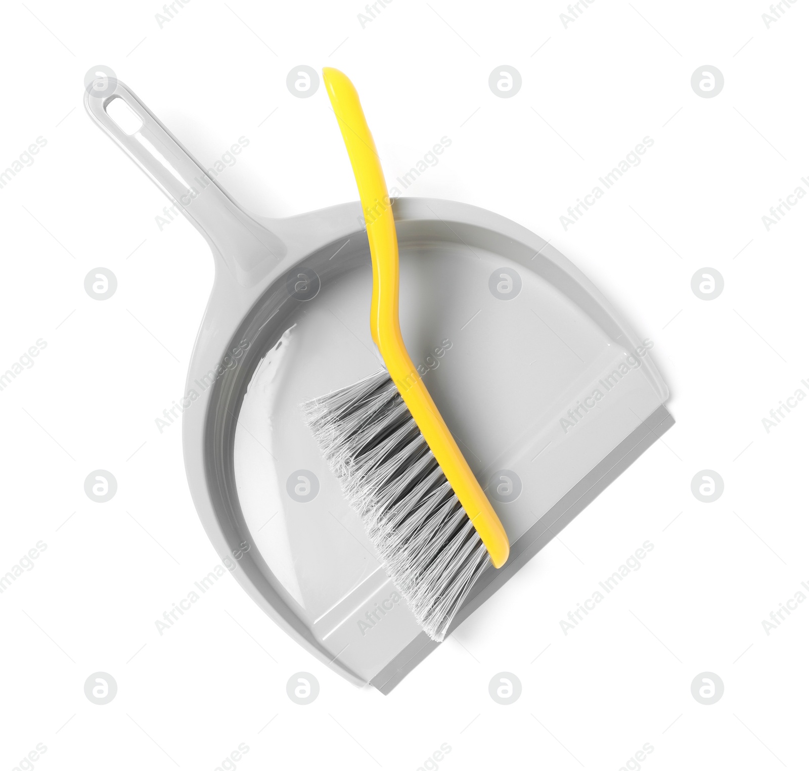 Photo of Plastic hand broom and dustpan isolated on white, top view
