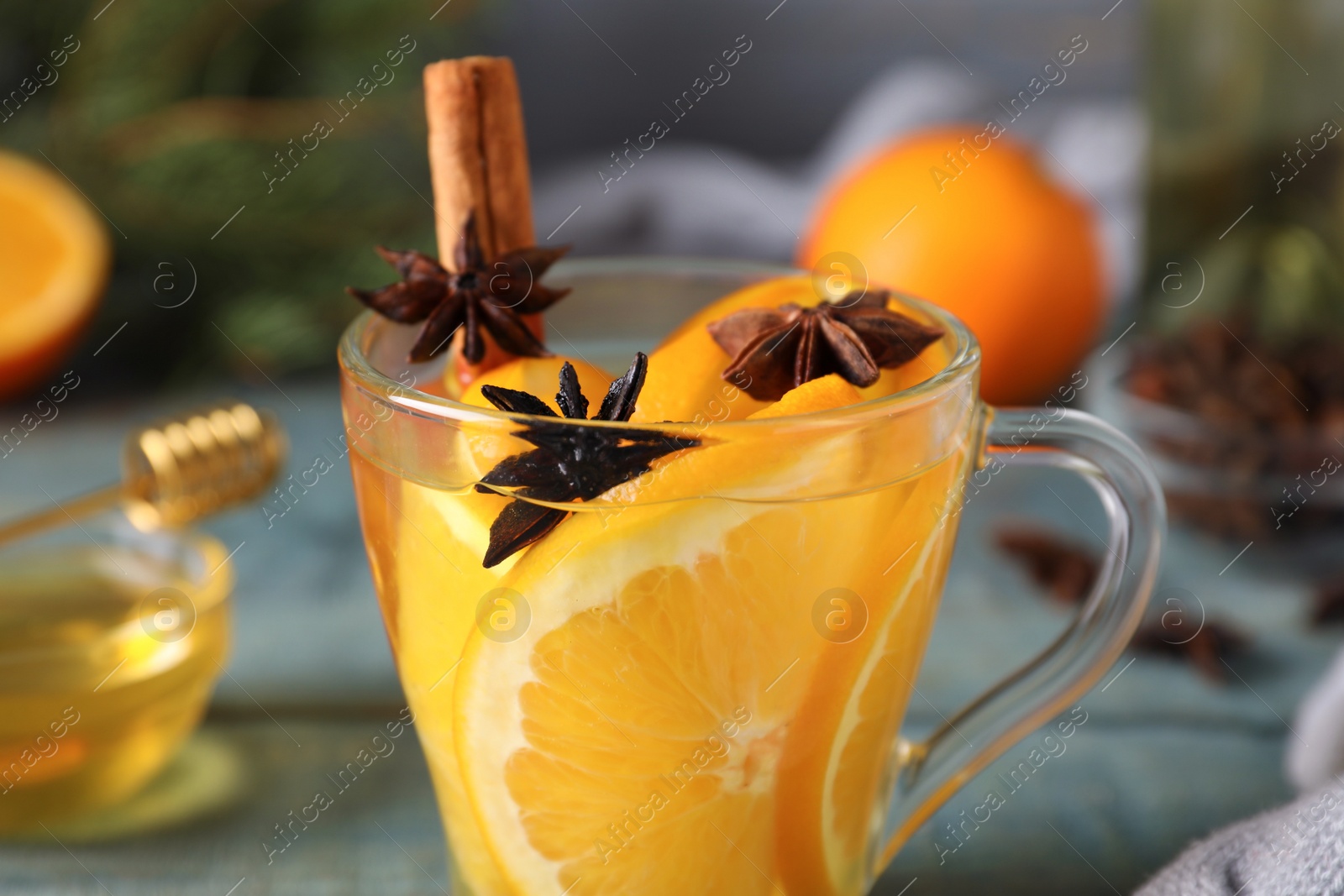 Photo of Delicious aromatic mulled wine on table, closeup