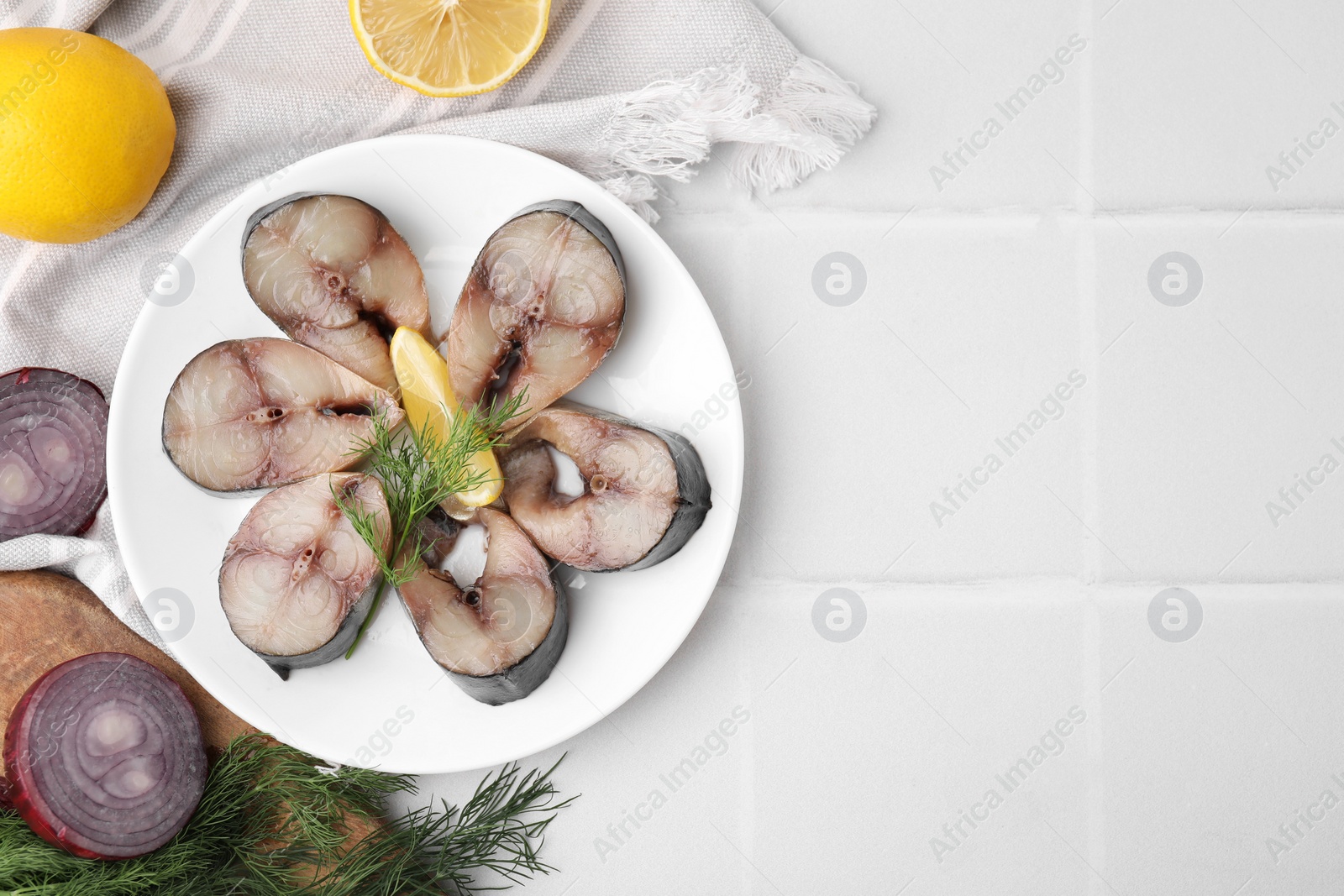 Photo of Slices of tasty salted mackerel and ingredients on white table, flat lay. Space for text