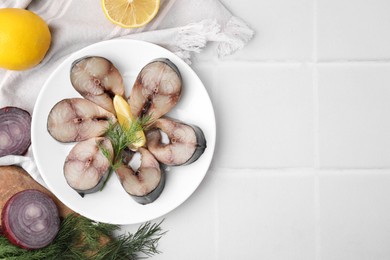 Photo of Slices of tasty salted mackerel and ingredients on white table, flat lay. Space for text