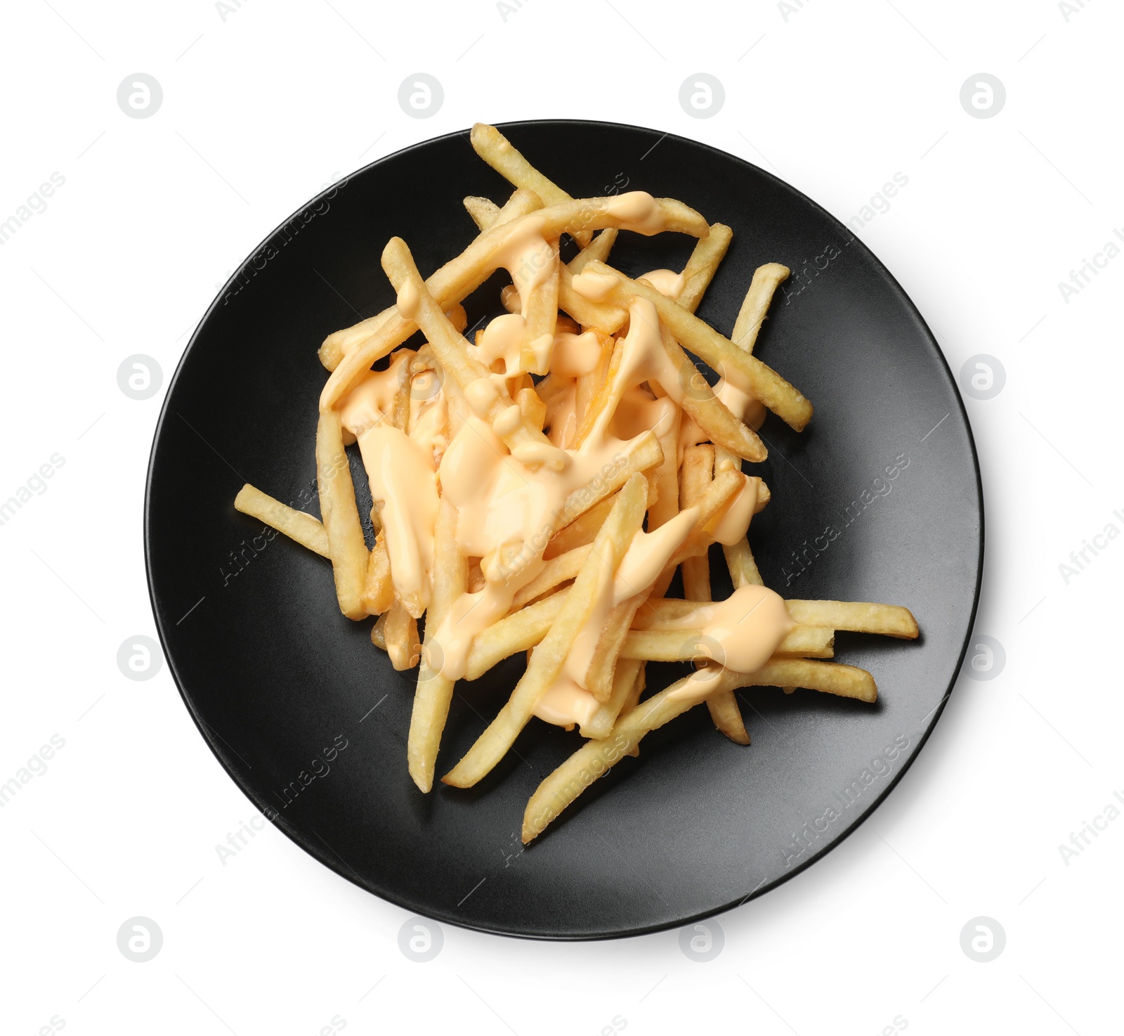 Photo of Delicious French fries with cheese sauce isolated on white, top view