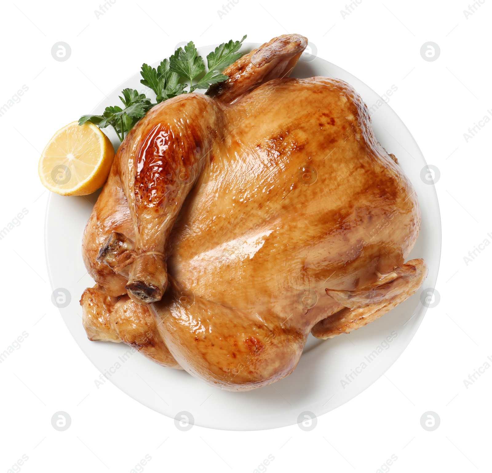 Photo of Tasty roasted chicken with parsley and lemon isolated on white, top view