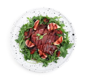 Photo of Plate of tasty bresaola salad with figs, sun-dried tomatoes and balsamic vinegar isolated on white, top view
