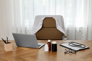 Photo of Modern doctor's workplace in stylish office. Interior design