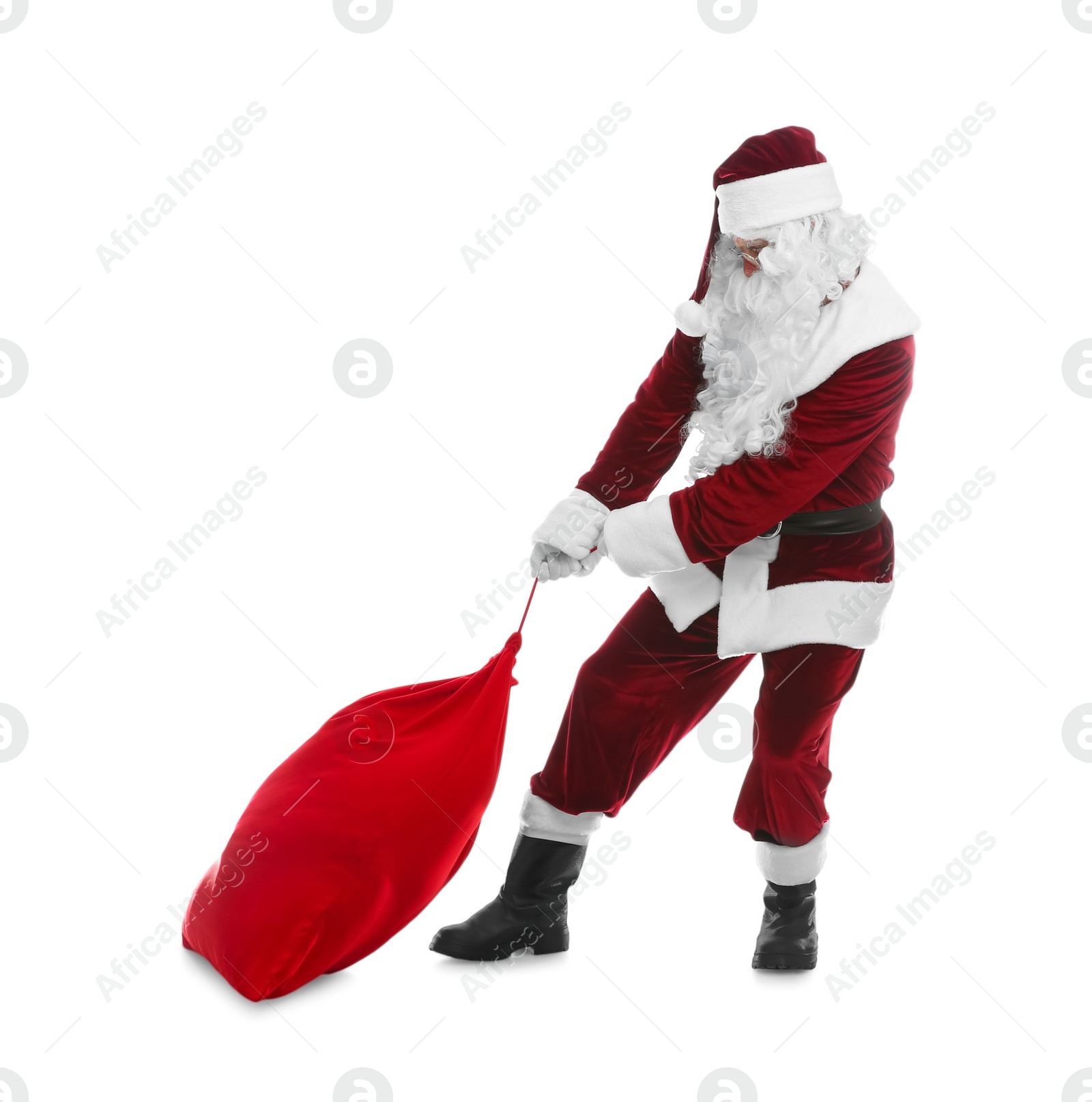 Photo of Santa Claus pulling red sack on white background