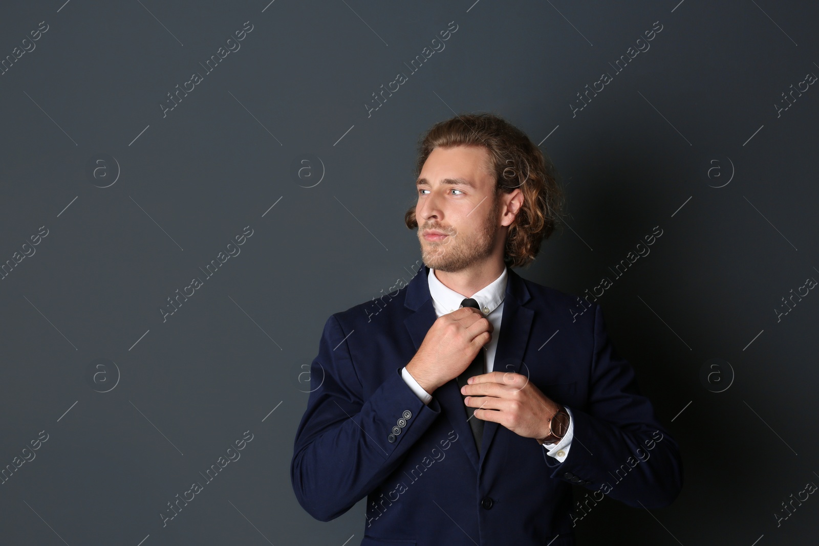 Photo of Portrait of handsome man on dark background