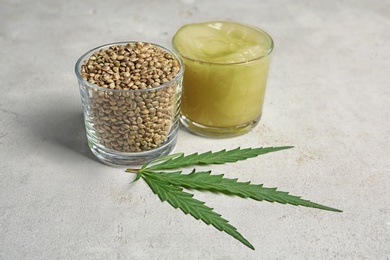 Photo of Composition with hemp lotion on grey background