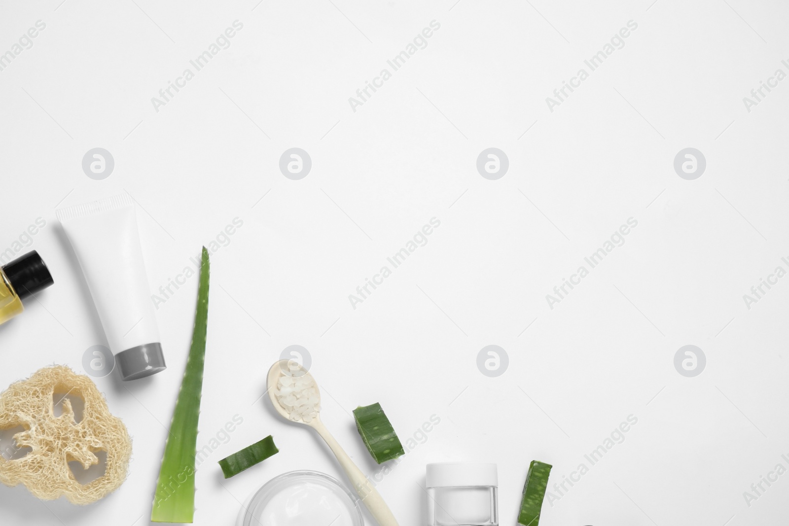 Photo of Flat lay composition with aloe vera and cosmetic products on white background