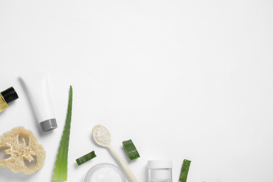 Flat lay composition with aloe vera and cosmetic products on white background