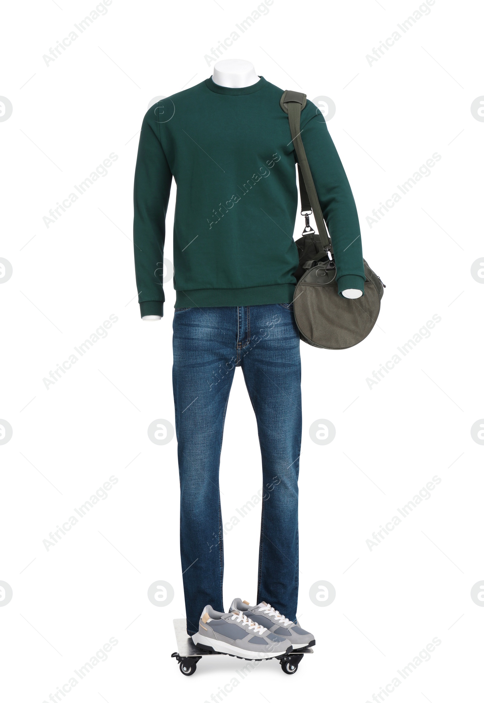 Photo of Male mannequin with bag dressed in stylish dark green sweatshirt and jeans isolated on white