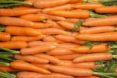 Ripe carrots as background, top view. Healthy diet