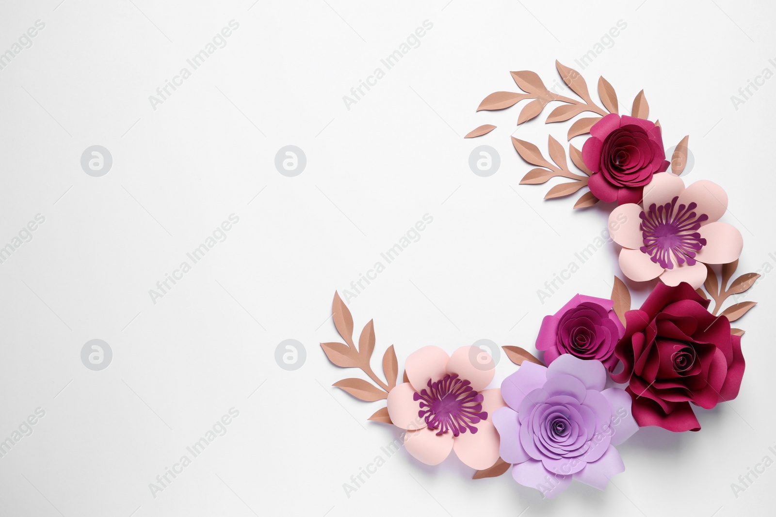 Photo of Different beautiful flowers and branches made of paper on white background, top view