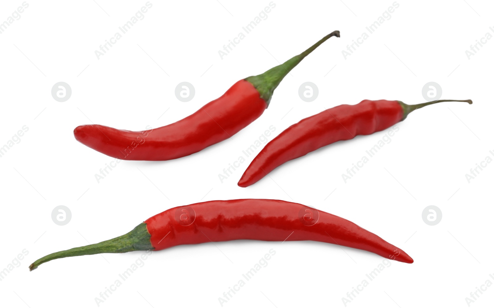 Photo of Red hot chili peppers on white background