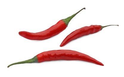 Photo of Red hot chili peppers on white background