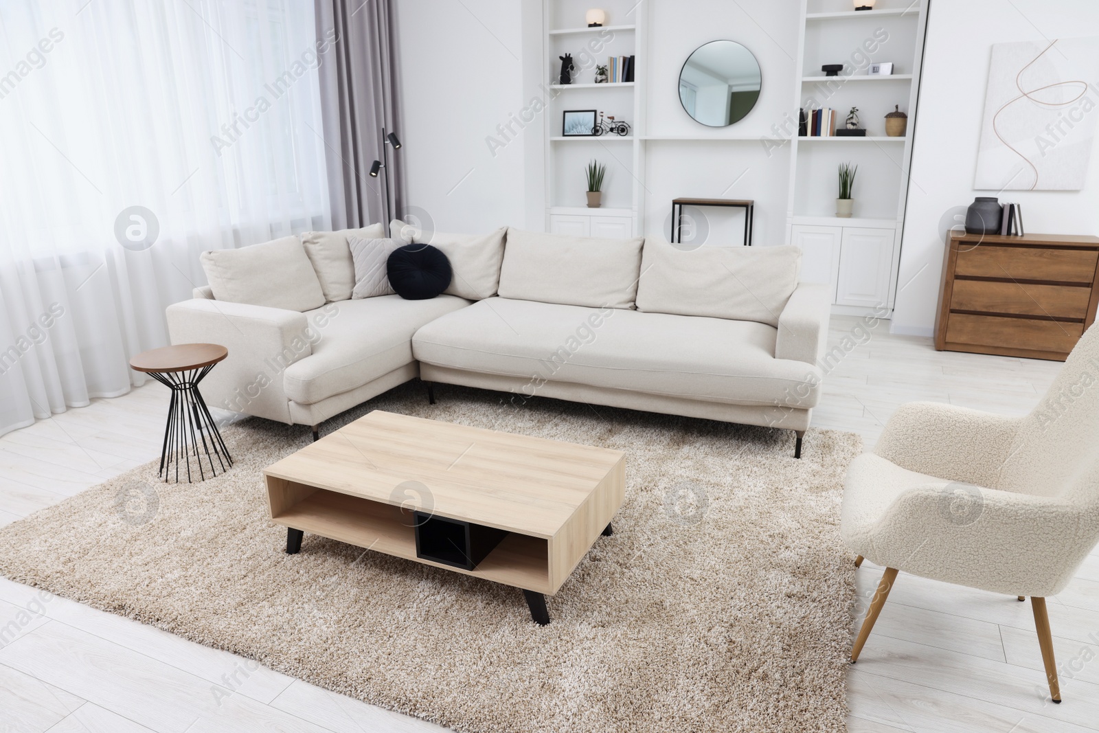 Photo of Beautiful carpet, furniture and accessories in living room