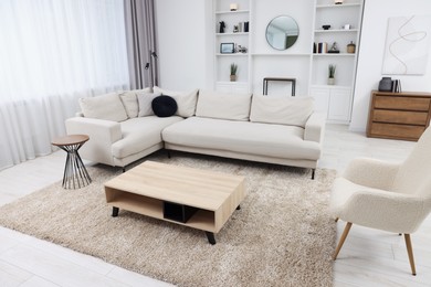 Photo of Beautiful carpet, furniture and accessories in living room