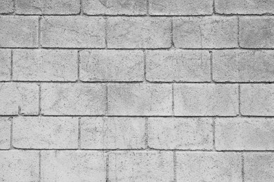 Texture of light grey brick wall as background