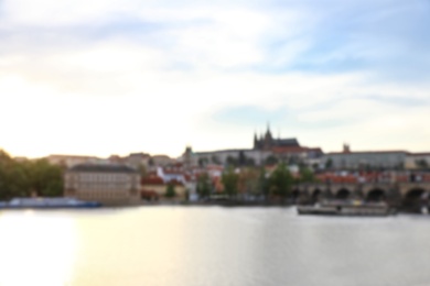 PRAGUE, CZECH REPUBLIC - APRIL 25, 2019: Blurred cityscape with Vltava river