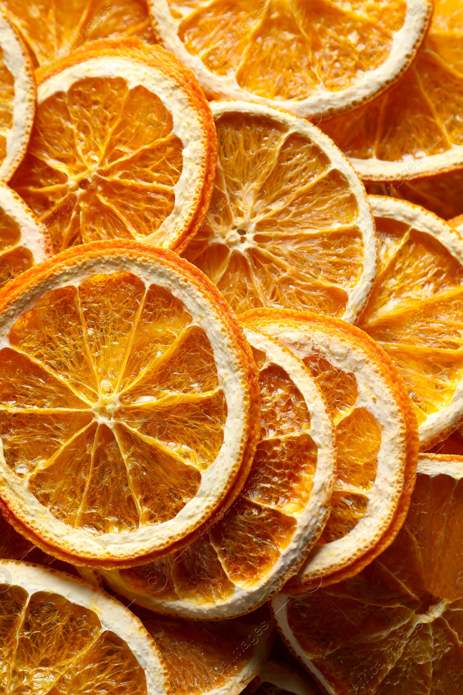 Photo of Many dry orange slices as background, top view